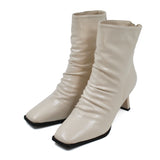 Modern rippled leather heel boots